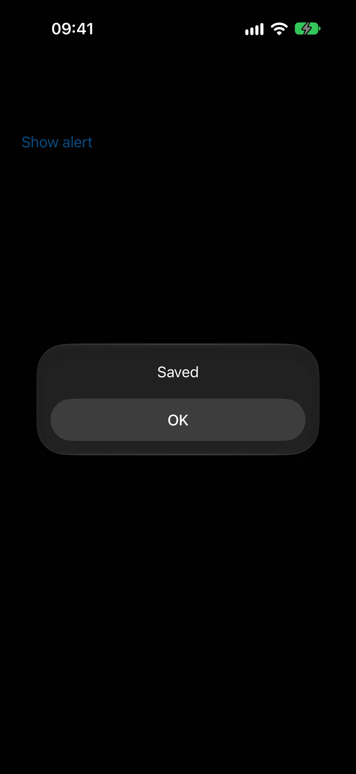 标题为 Saved、包含单个 OK 按钮的 Alert，位于 Show alert 触发器上方