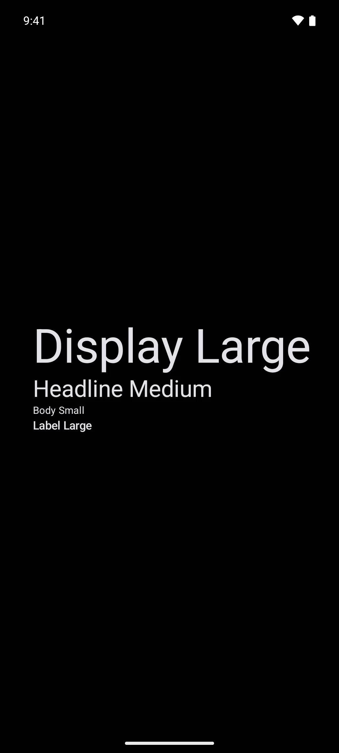 四行文字，分别展示 display large、headline medium、body small 和 label large 字号